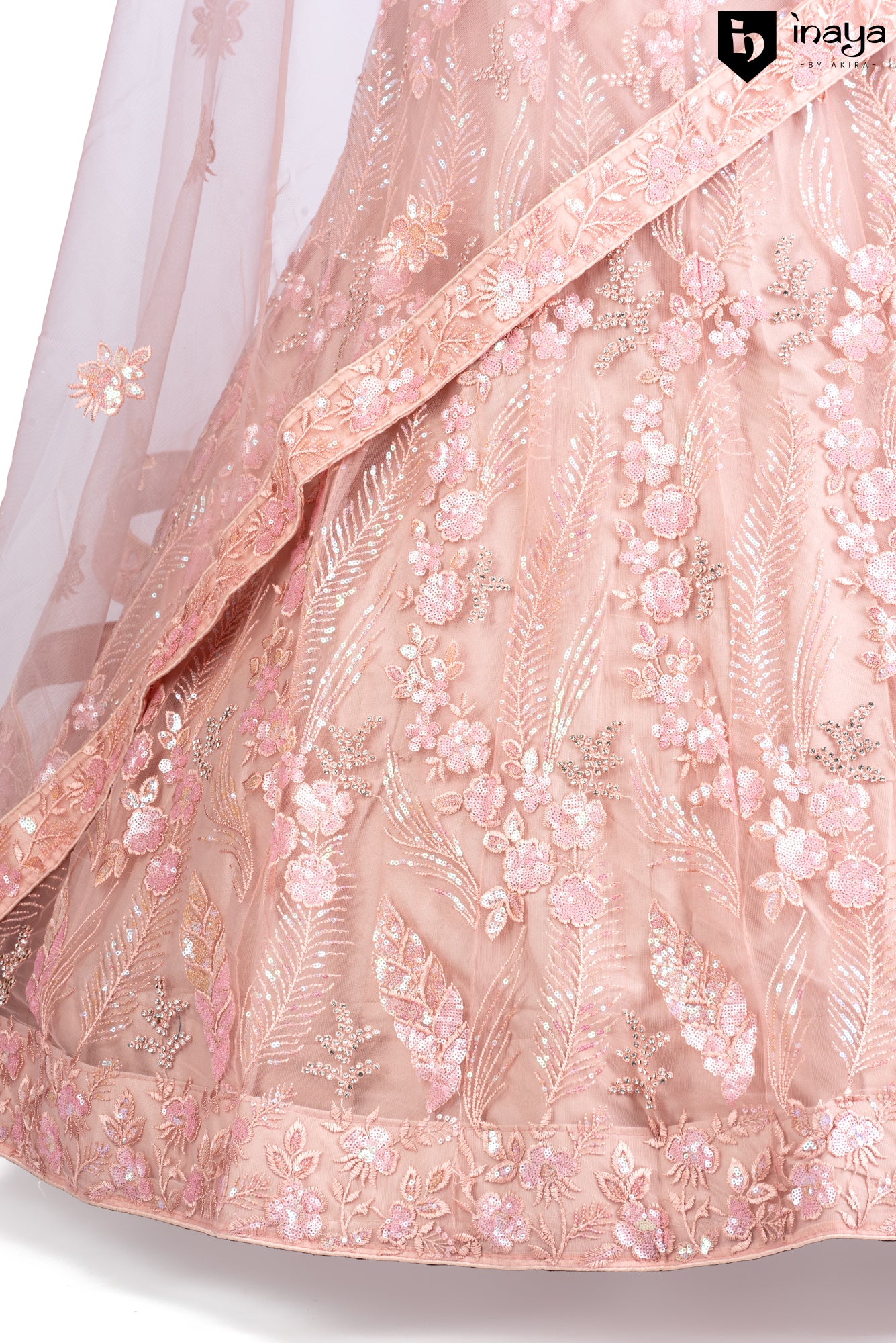 Peach Perfection: A Net Lehenga with Floral Embellishments