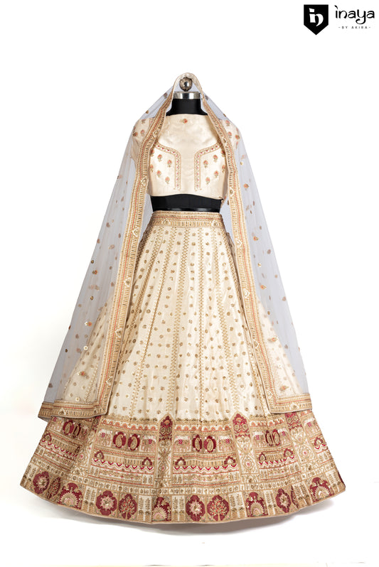 Golden Elegance: Semi-Stitched Ivory Raw Silk Lehenga with Bejeweled Accents