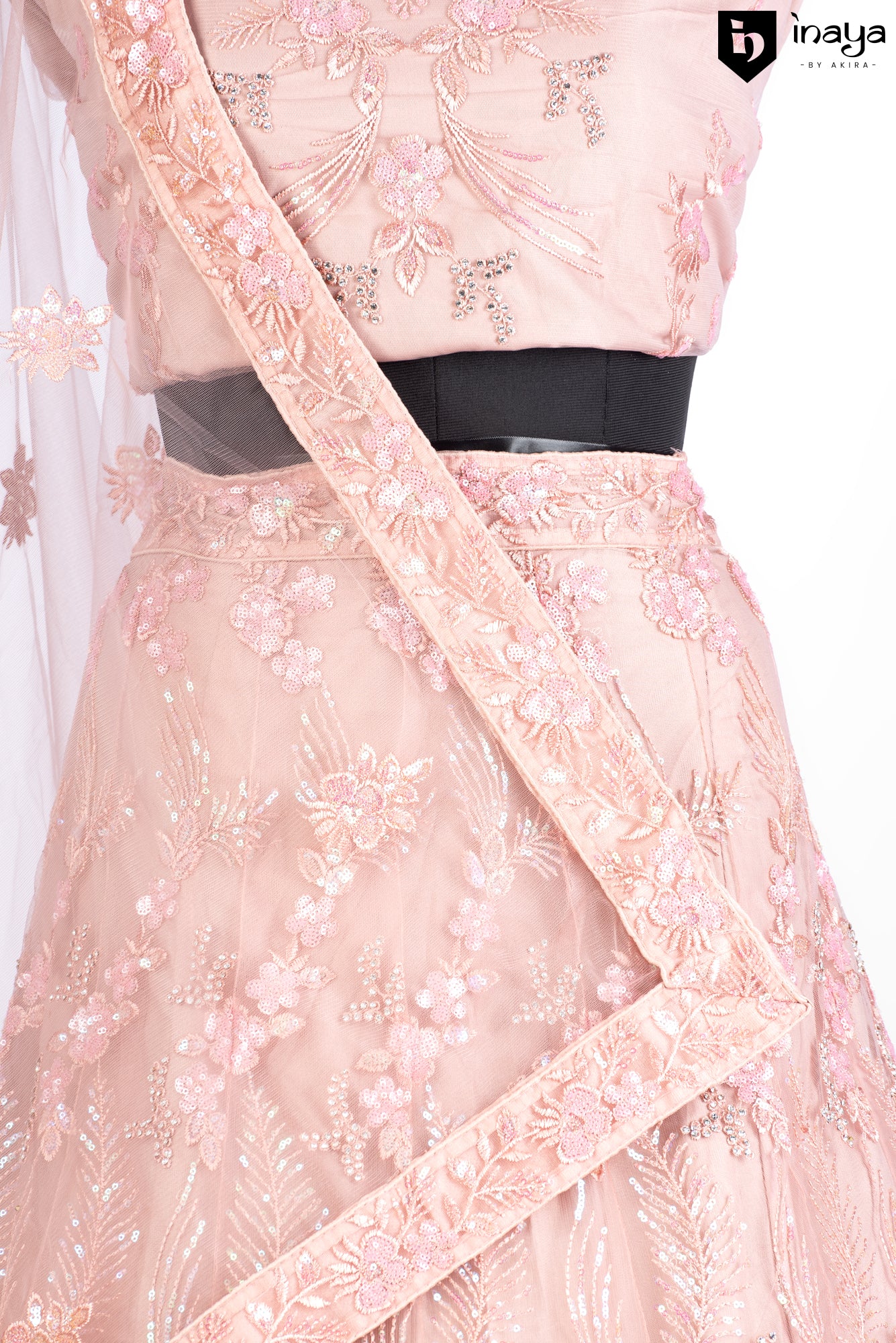 Peach Perfection: A Net Lehenga with Floral Embellishments