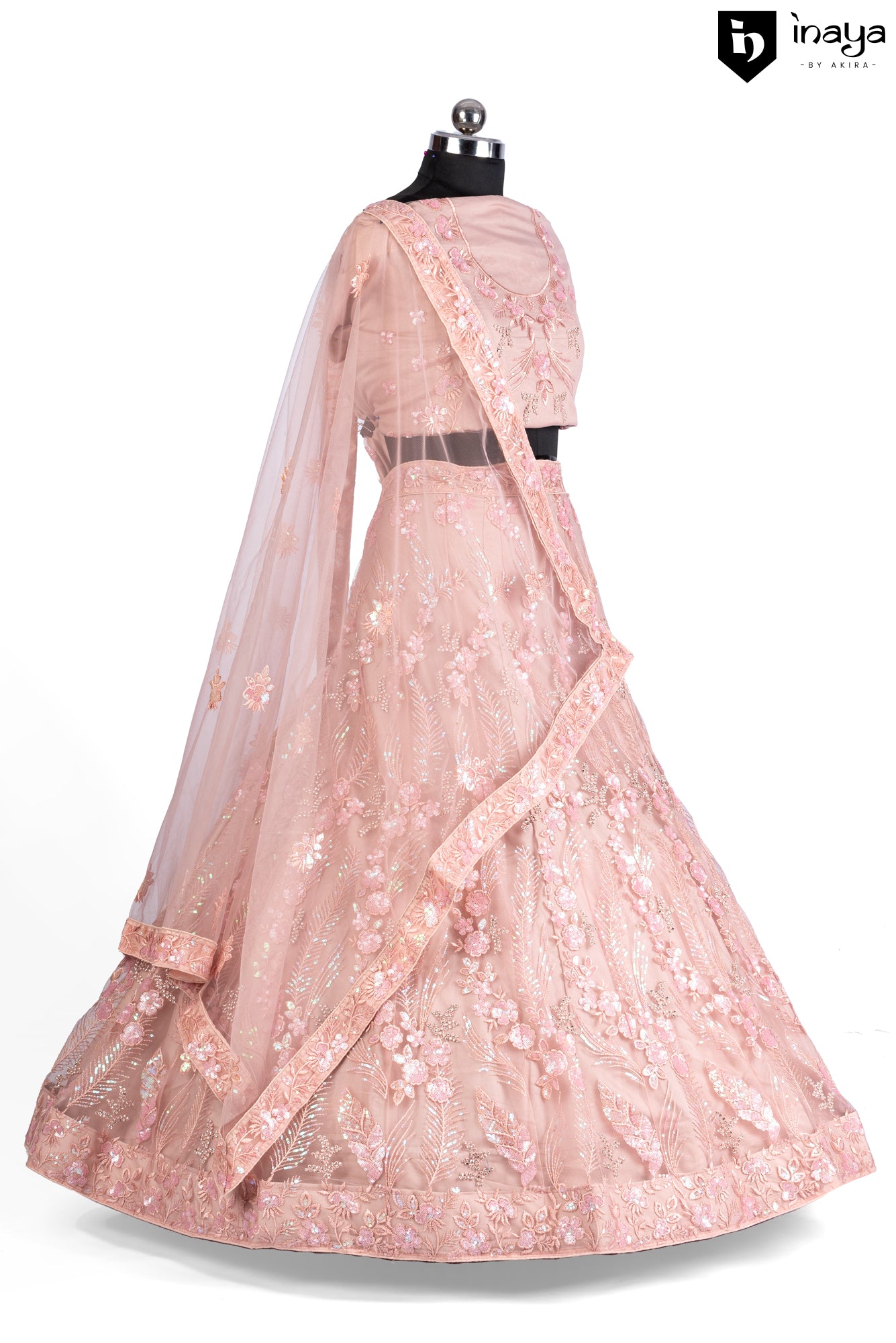 Peach Perfection: A Net Lehenga with Floral Embellishments