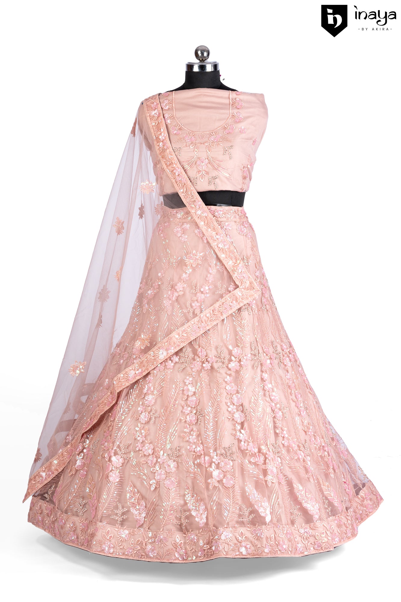 Peach Perfection: A Net Lehenga with Floral Embellishments